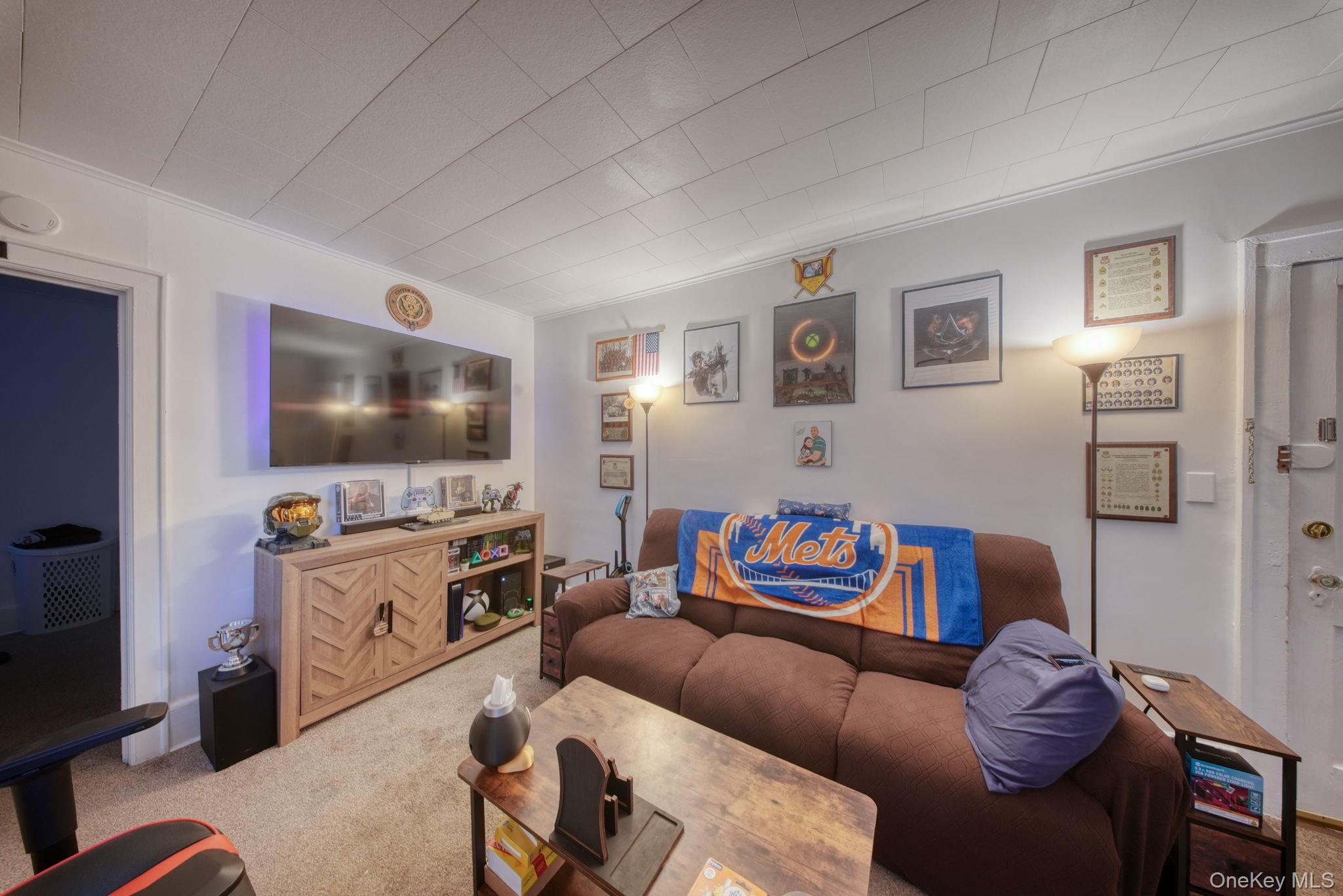 9 Mongaup Road Hurleyville, NY 12747 - Photo 31 of 35 Carpeted living area with crown molding