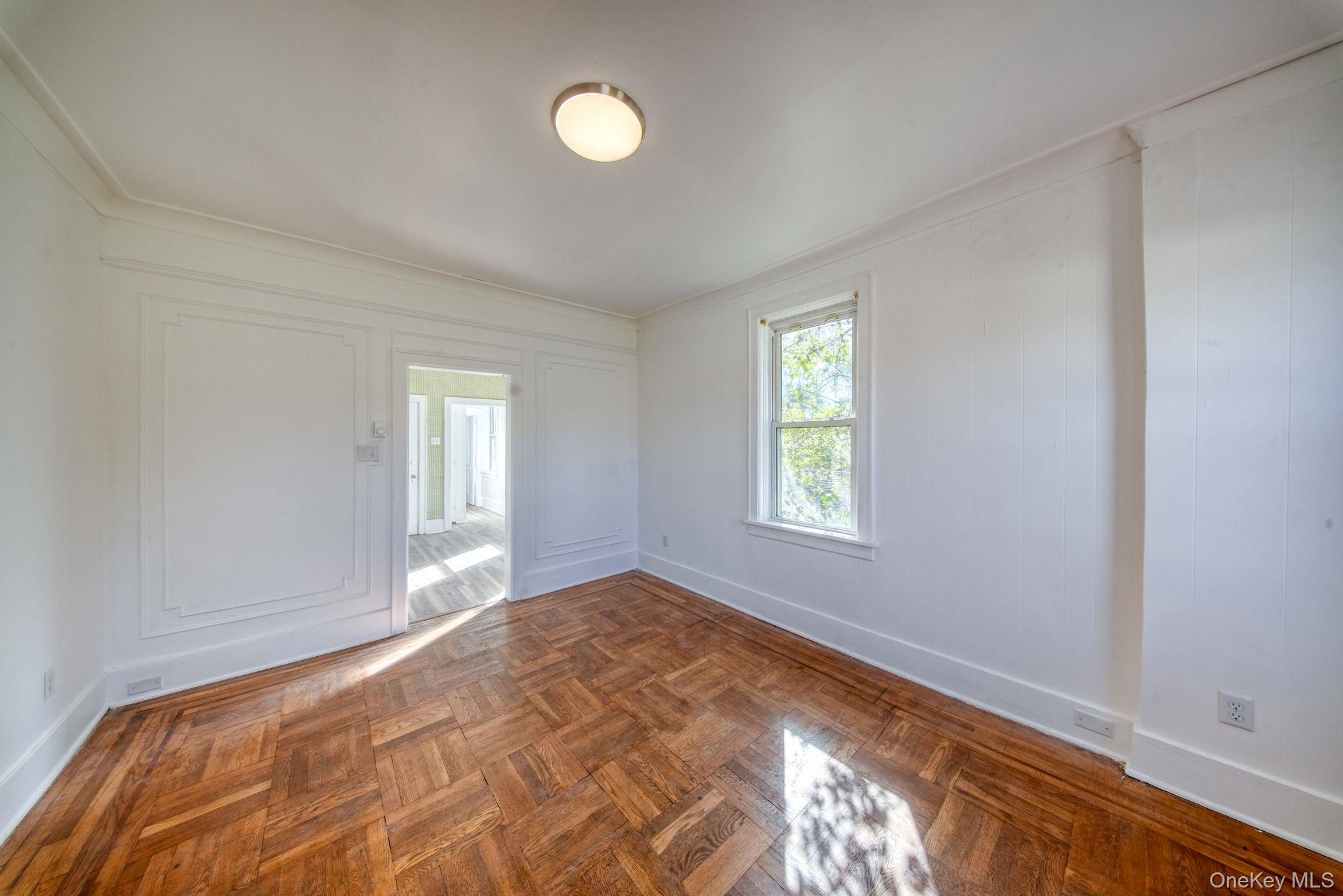 9 Mongaup Road Hurleyville, NY 12747 - Photo 7 of 35 Empty room with crown molding and a decorative wall
