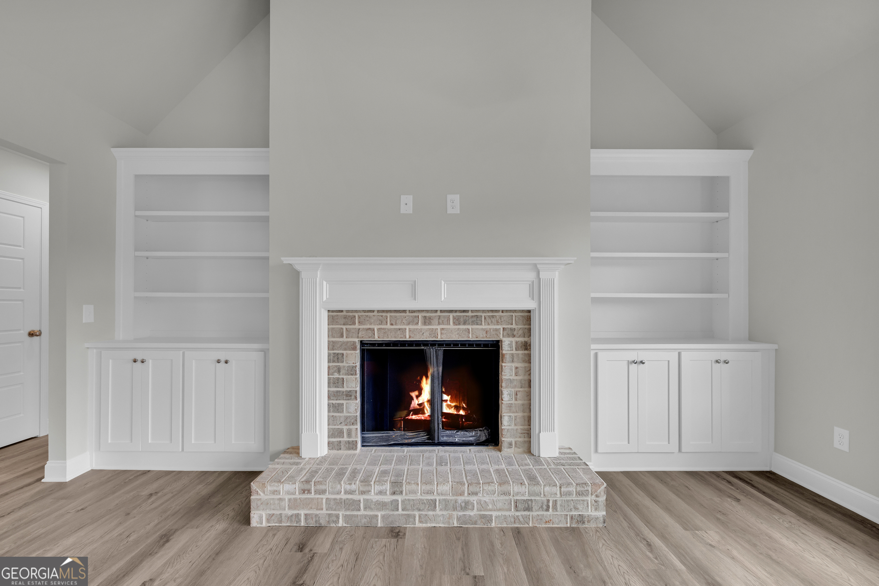 110 Sewell Road Lavonia, GA 30553 - Photo 30 of 73 a living room with a fireplace and a fireplace