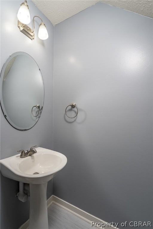 9313 South Courthouse Road Providence Forge, VA 23140 - Photo 21 of 35 a bathroom with a sink a mirror and vanity