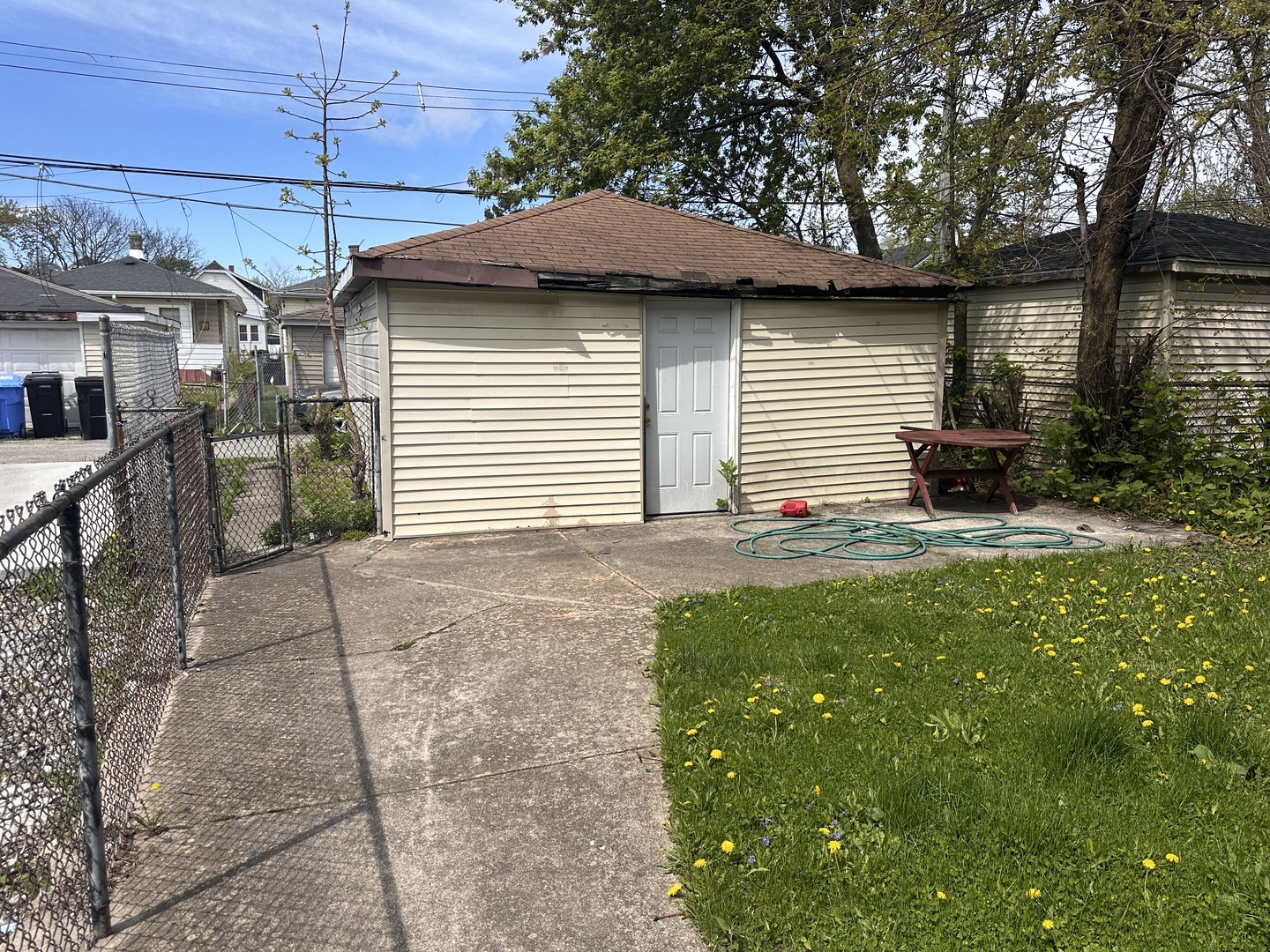 26 East 101st Place Chicago, IL 60628 - Photo 20 of 22 a front view of a house with a garden