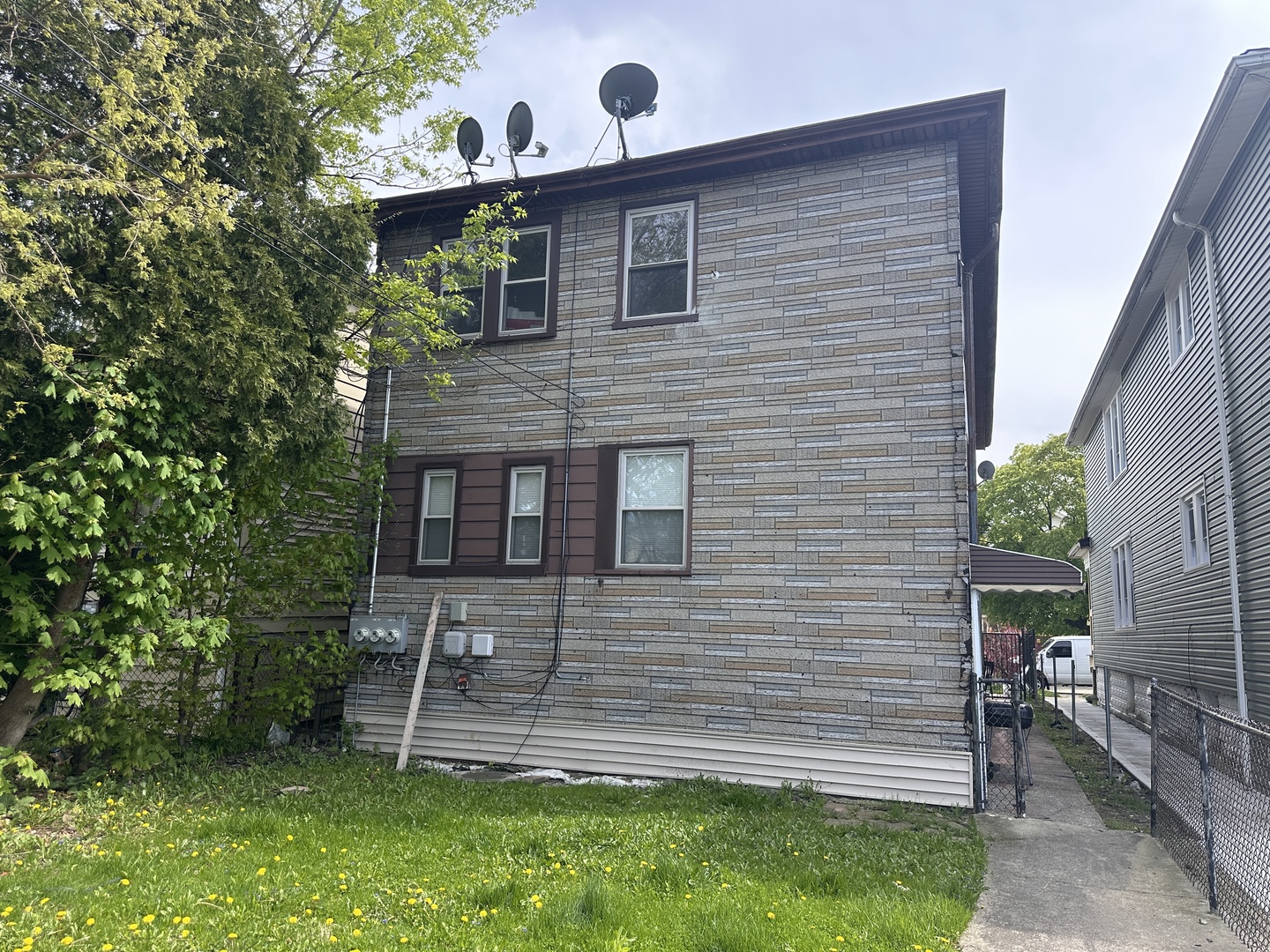 26 East 101st Place Chicago, IL 60628 - Photo 22 of 22 a front view of a house with a yard