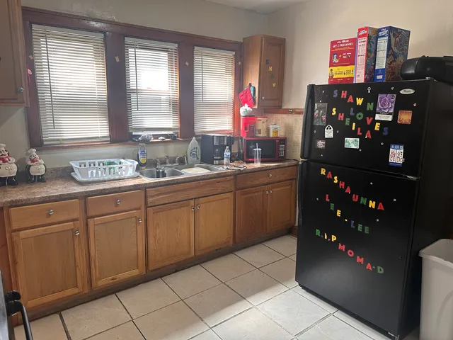 a kitchen with stainless steel appliances cabinets and potted plant