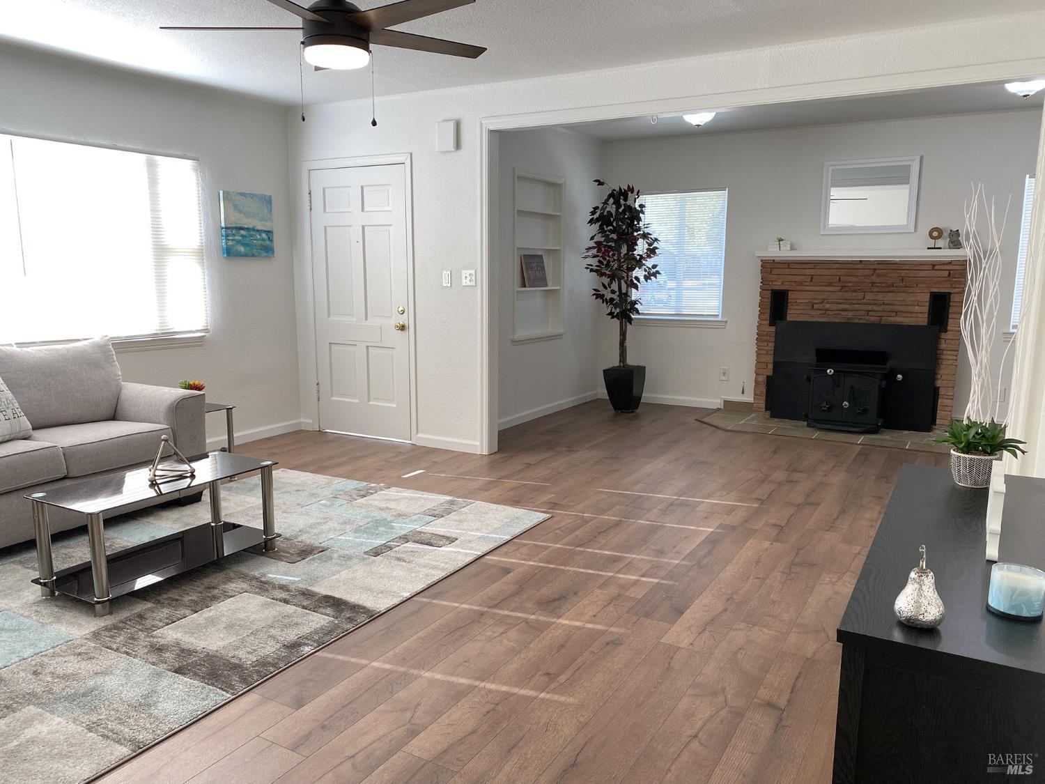 1047 Ohio Street Fairfield, CA 94533 - Photo 11 of 36 a living room with furniture and a fireplace
