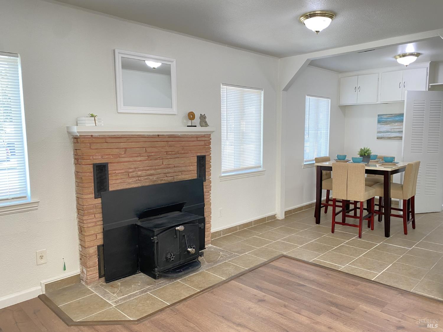 1047 Ohio Street Fairfield, CA 94533 - Photo 12 of 36 a living room with furniture and a fireplace