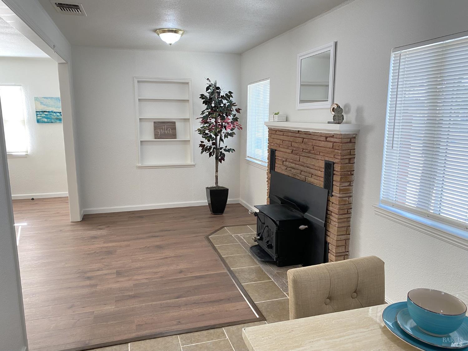 1047 Ohio Street Fairfield, CA 94533 - Photo 13 of 36 a living room with furniture and a fireplace