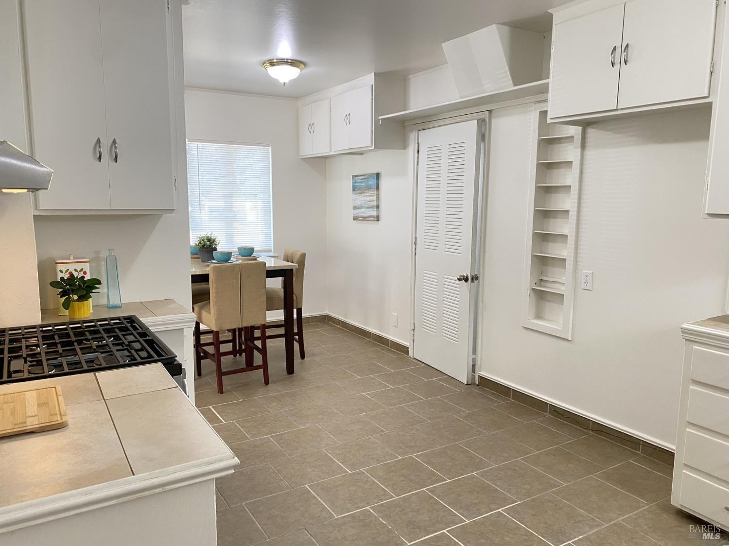 1047 Ohio Street Fairfield, CA 94533 - Photo 18 of 36 a kitchen with stainless steel appliances a refrigerator and a stove top oven