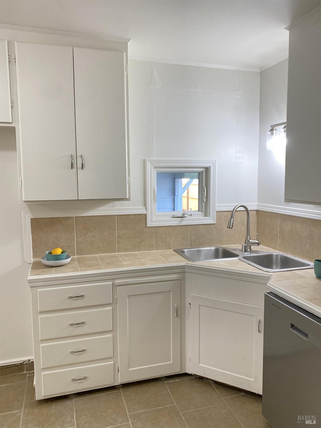 1047 Ohio Street Fairfield, CA 94533 - Photo 19 of 36 a kitchen with cabinets appliances and a sink