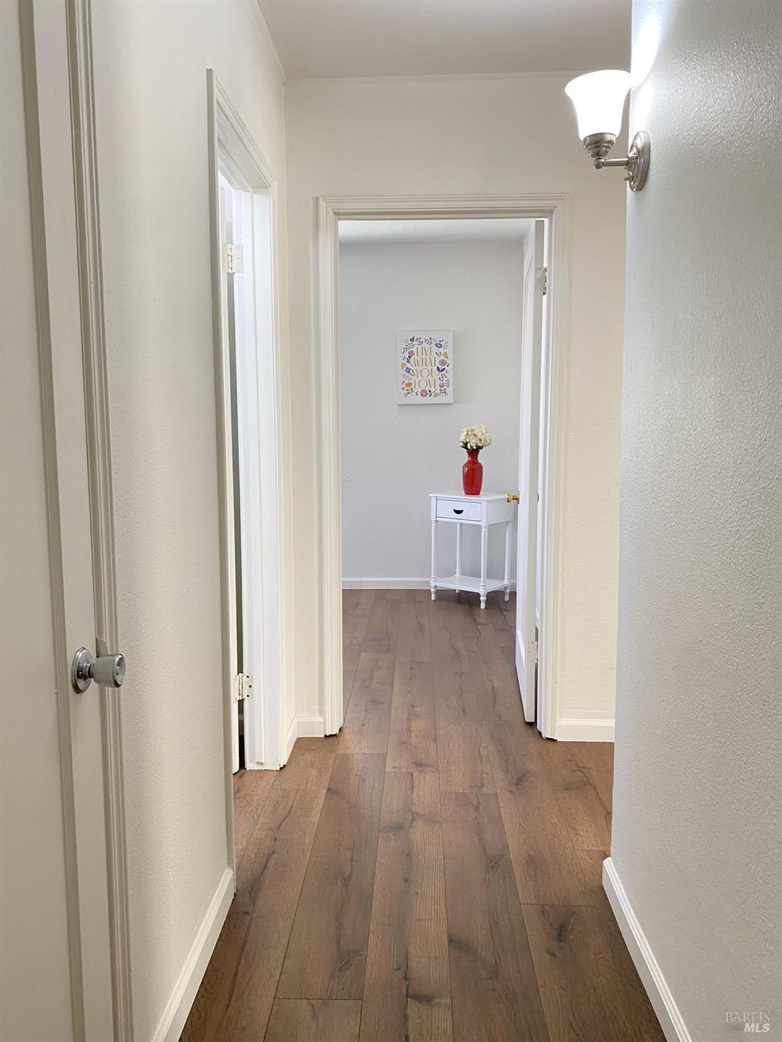 1047 Ohio Street Fairfield, CA 94533 - Photo 20 of 36 a view of a hallway with wooden floor and closet