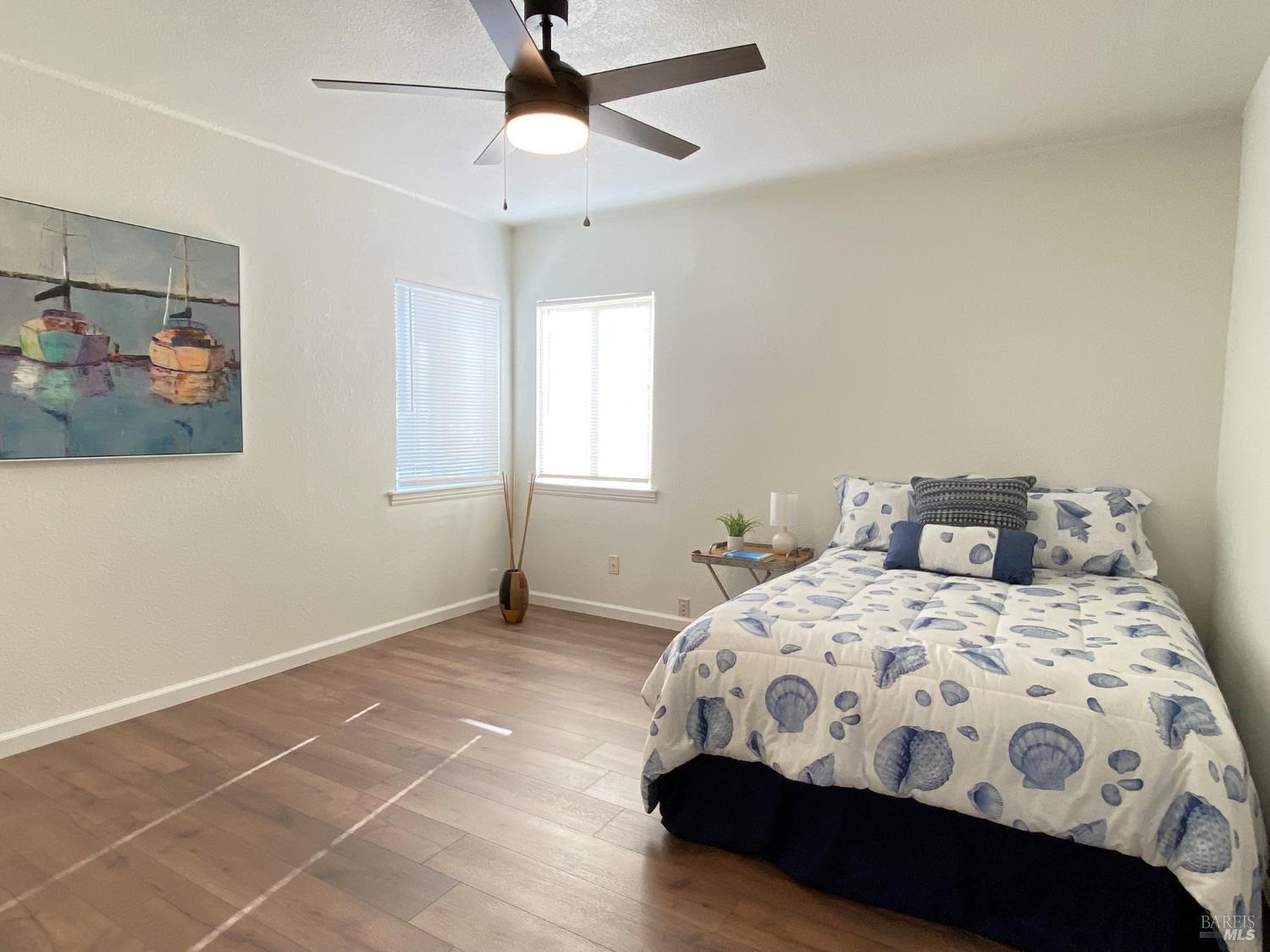 1047 Ohio Street Fairfield, CA 94533 - Photo 24 of 36 a bedroom with a bed a window and painting on the wall