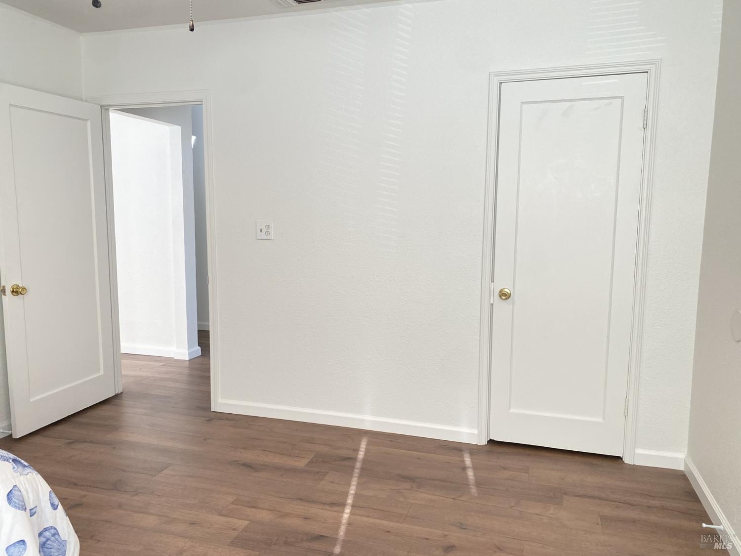 1047 Ohio Street Fairfield, CA 94533 - Photo 25 of 36 a view of an empty room with wooden floor and closet