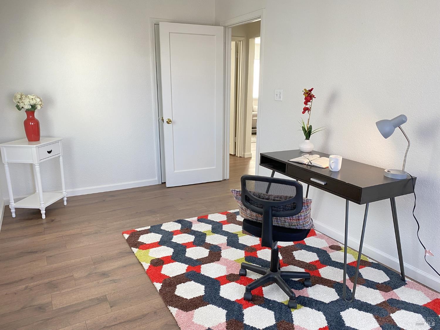 1047 Ohio Street Fairfield, CA 94533 - Photo 27 of 36 a room with furniture and wooden floor