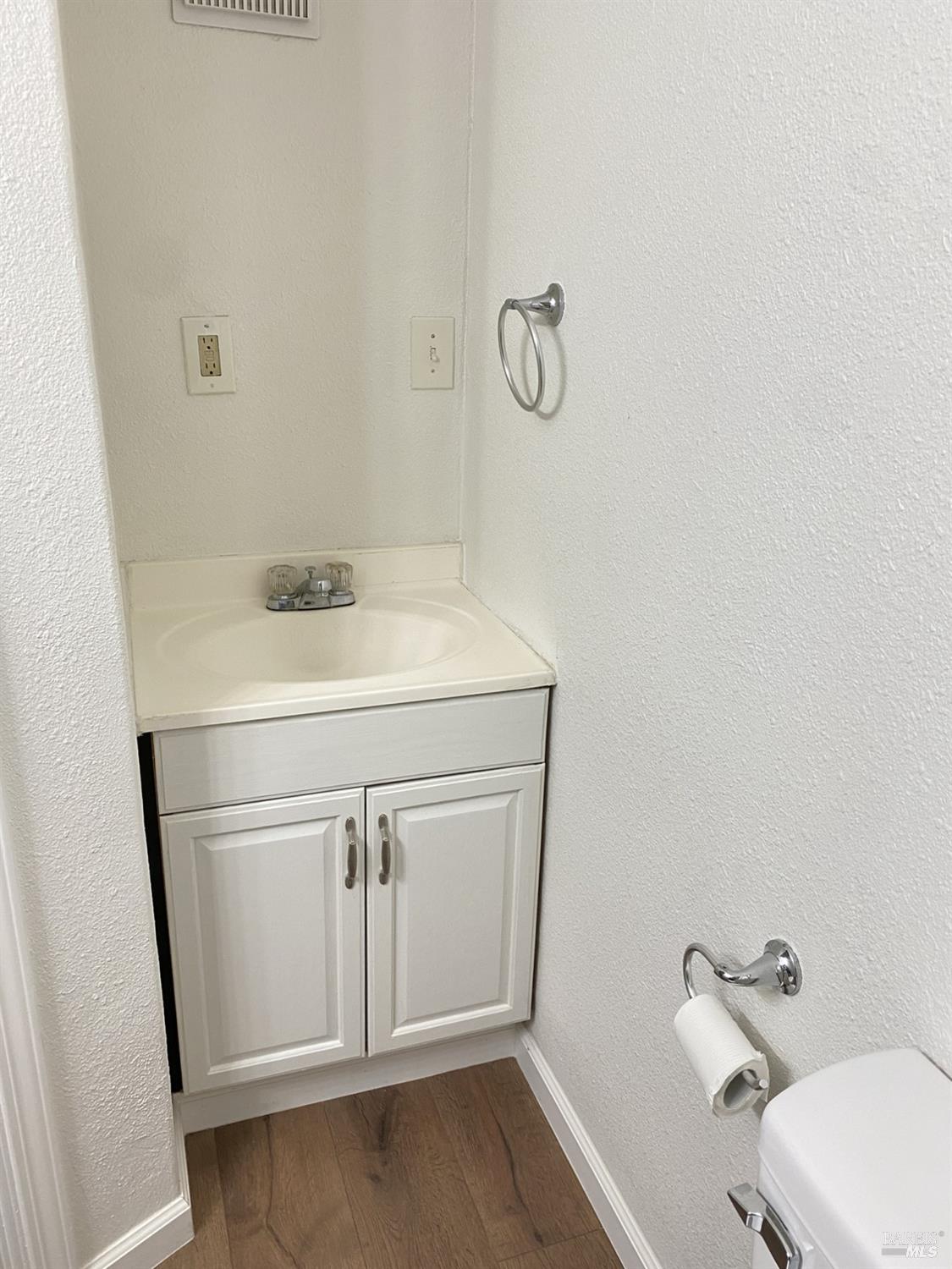 1047 Ohio Street Fairfield, CA 94533 - Photo 29 of 36 a bathroom with a sink a toilet and vanity