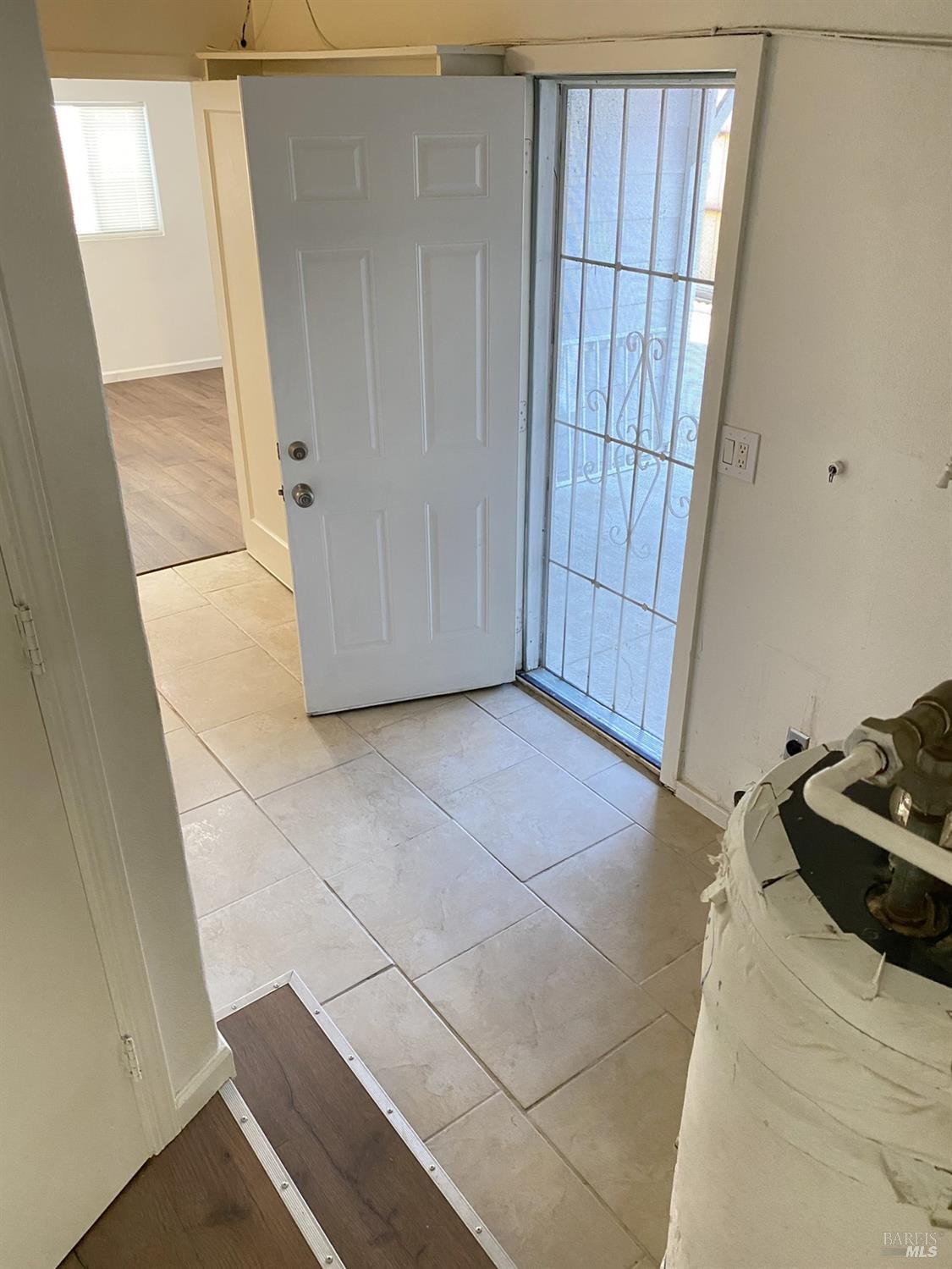 1047 Ohio Street Fairfield, CA 94533 - Photo 31 of 36 a view of a closet area with ceiling fan