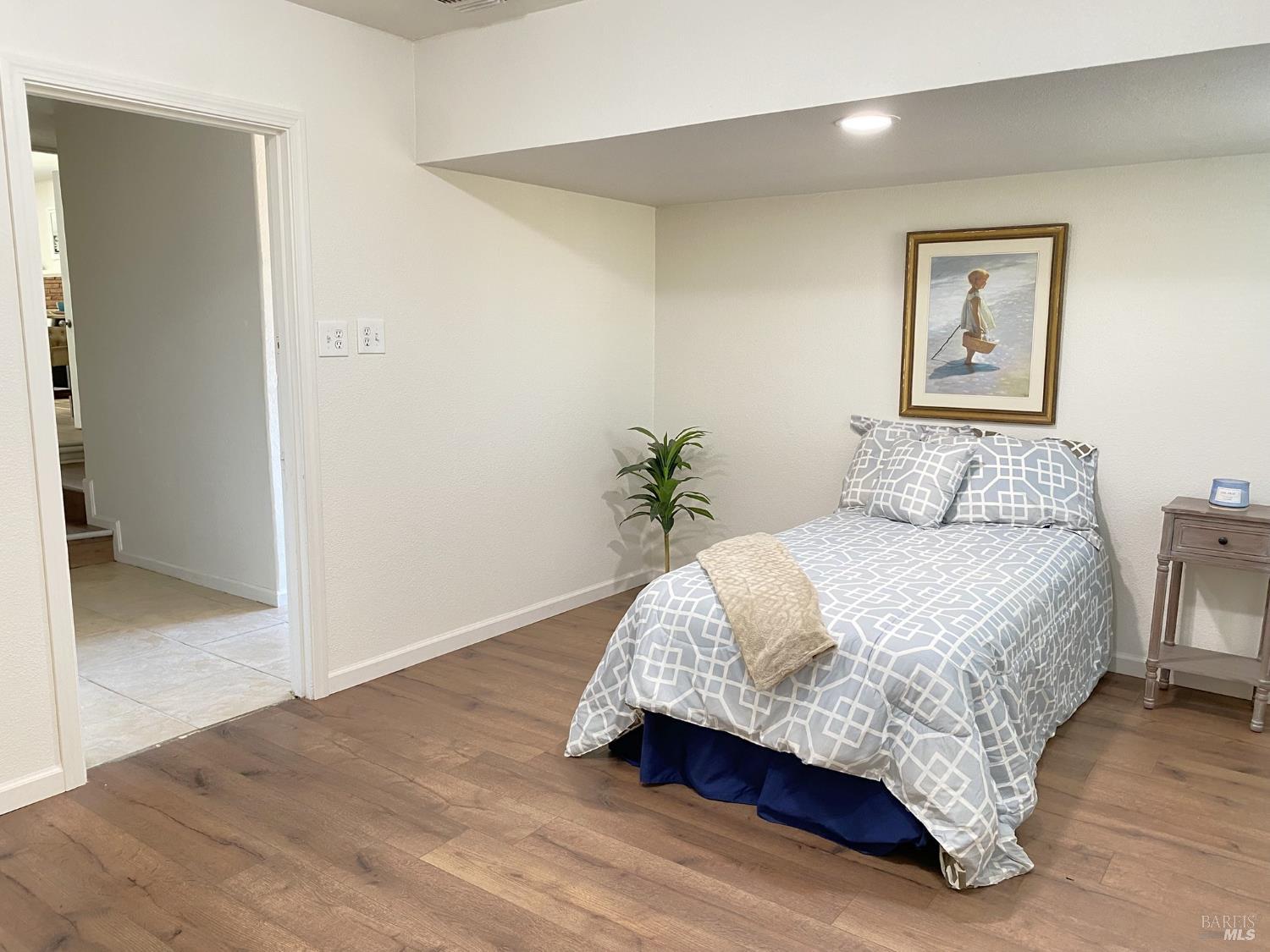 1047 Ohio Street Fairfield, CA 94533 - Photo 33 of 36 a bedroom with a bed and painting on the wall