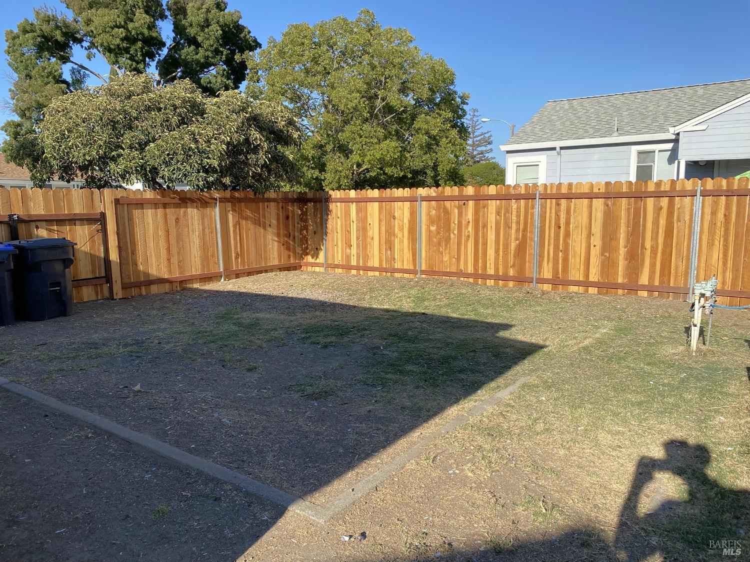 1047 Ohio Street Fairfield, CA 94533 - Photo 34 of 36 a view of a backyard with wooden fence
