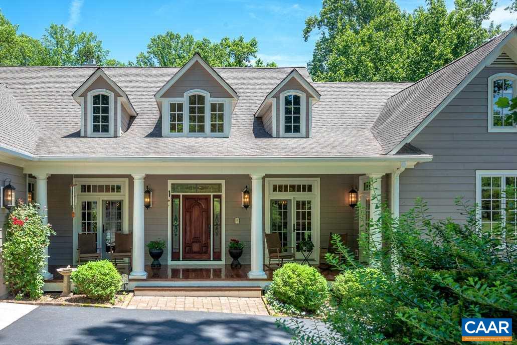 2274 Garth Road Charlottesville, VA 22901 - Photo 1 of 32 a front view of a house with a yard
