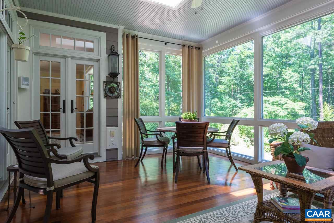 2274 Garth Road Charlottesville, VA 22901 - Photo 12 of 32 a view of a dining room with furniture and wooden floor