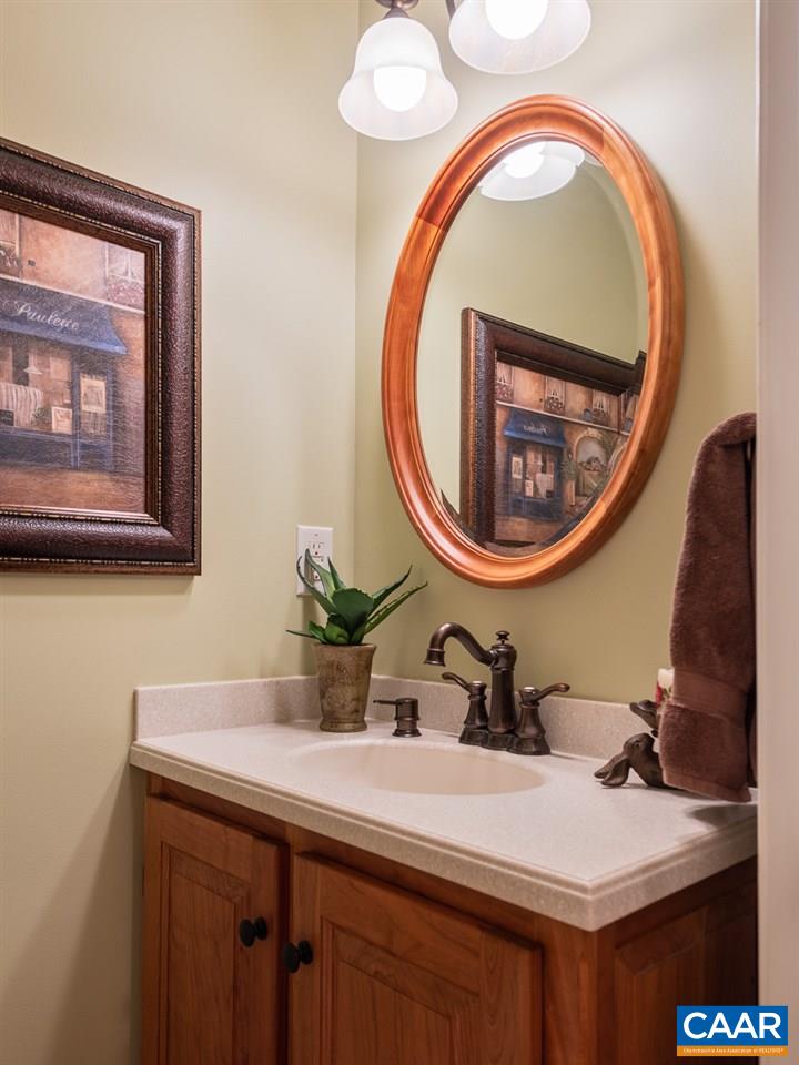 2274 Garth Road Charlottesville, VA 22901 - Photo 13 of 32 a bathroom with a sink and a mirror