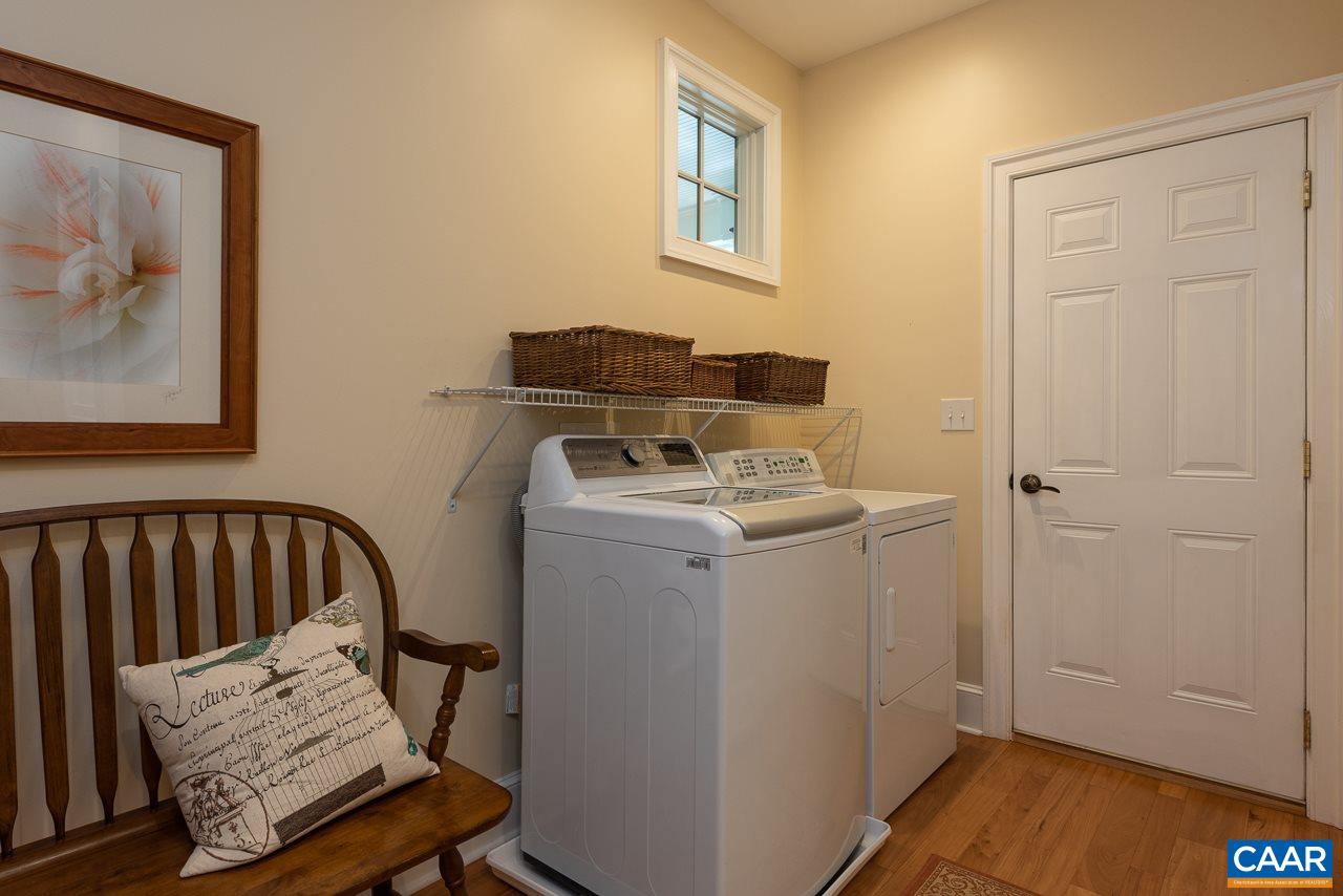 2274 Garth Road Charlottesville, VA 22901 - Photo 19 of 32 a utility room with a sink dryer and washer