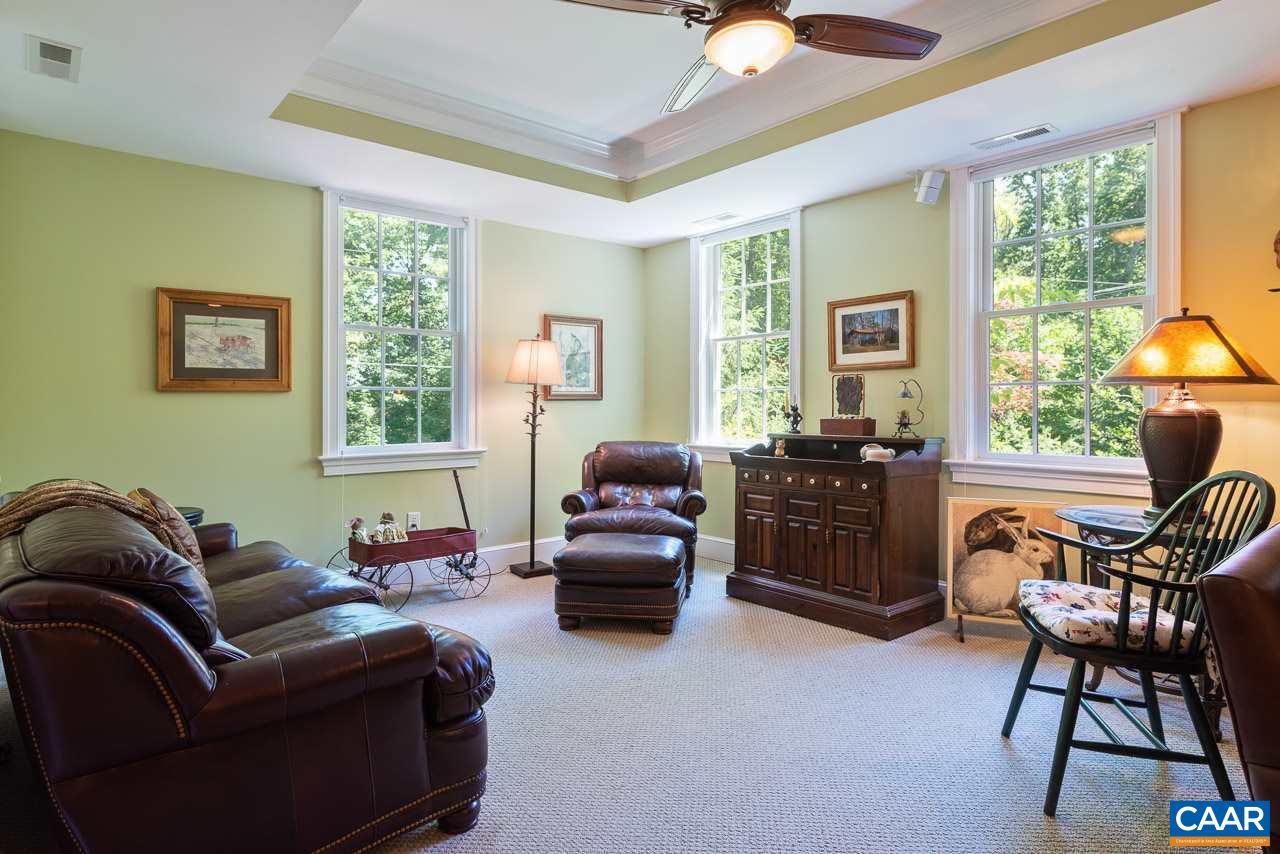 2274 Garth Road Charlottesville, VA 22901 - Photo 21 of 32 a living room with furniture and a window