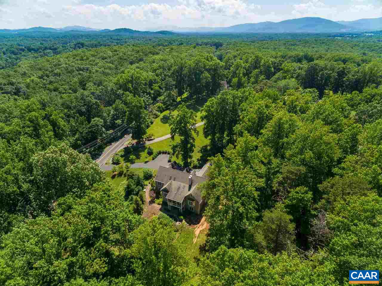2274 Garth Road Charlottesville, VA 22901 - Photo 31 of 32 a view of a lush green forest with trees and some houses