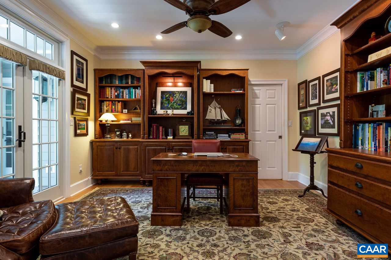 2274 Garth Road Charlottesville, VA 22901 - Photo 4 of 32 a living room with furniture and a book shelf