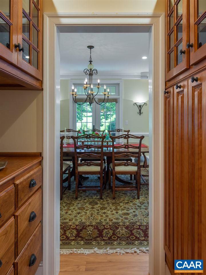 2274 Garth Road Charlottesville, VA 22901 - Photo 6 of 32 a view of a dining room with furniture and chandelier