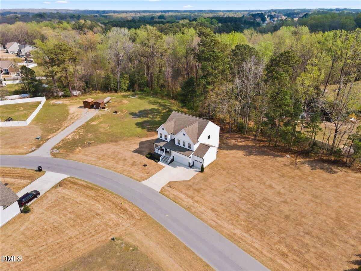 1237 Huffington Oak Drive Willow Spring, NC 27592 - Photo 1 of 34 a view of a swimming pool with a yard