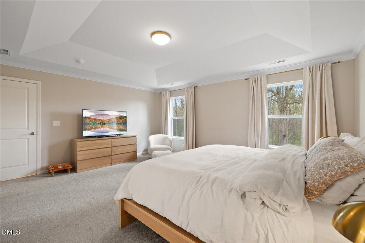 1237 Huffington Oak Drive Willow Spring, NC 27592 - Photo 18 of 34 a bedroom with a bed and a window