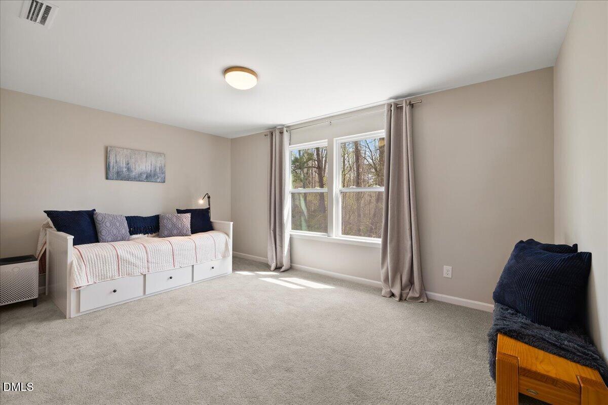 1237 Huffington Oak Drive Willow Spring, NC 27592 - Photo 26 of 34 a bed room with furniture and a window