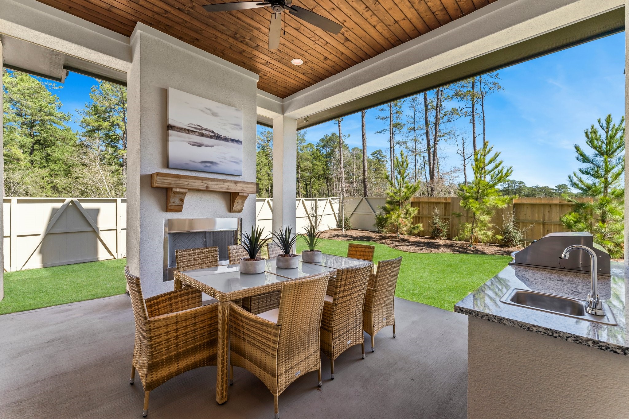 322 Marsh Wren Way Magnolia, TX 77354 - Photo 17 of 19 a view of a patio with table and chairs and potted plants