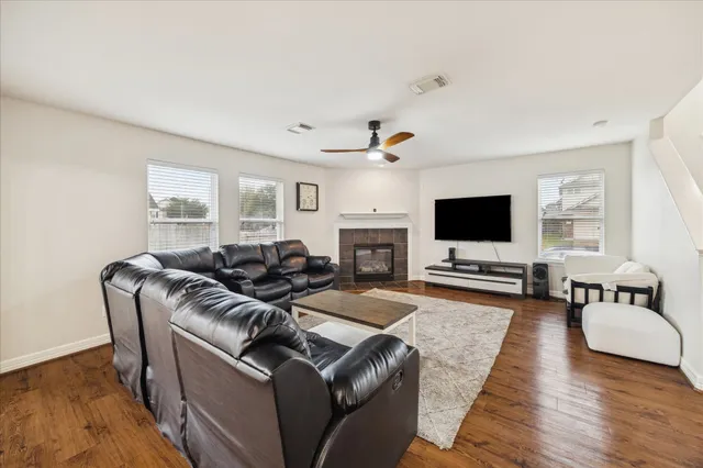a living room with furniture and a flat screen tv