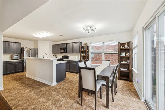 a view of a dining room kitchen and a window