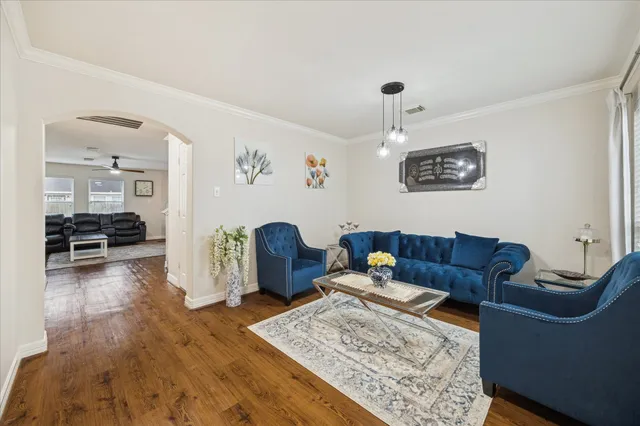 a living room with furniture and a table