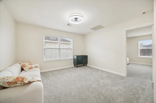 a living room with furniture and a window