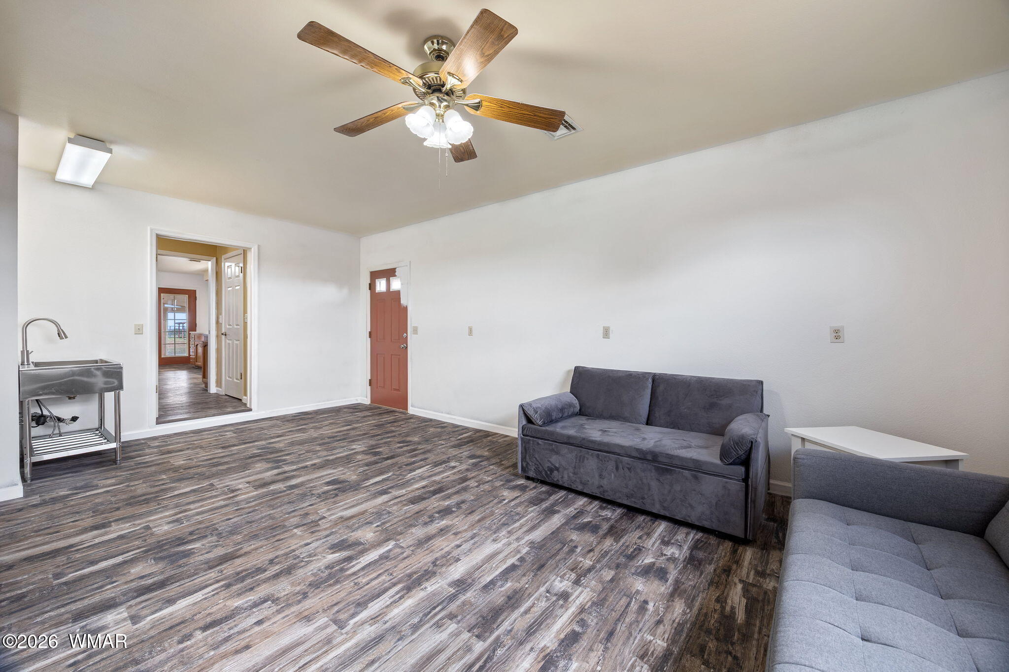 5335 Hay Hollow Road Snowflake, AZ 85937 - Photo 12 of 42 a living room with furniture and a wooden floor