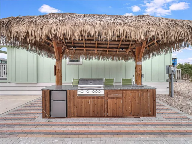 a kitchen with a refrigerator and a sink