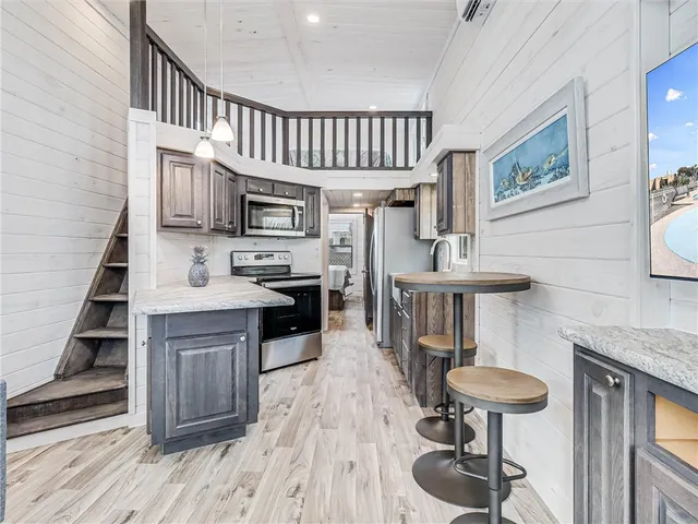 a kitchen with sink cabinets and appliances