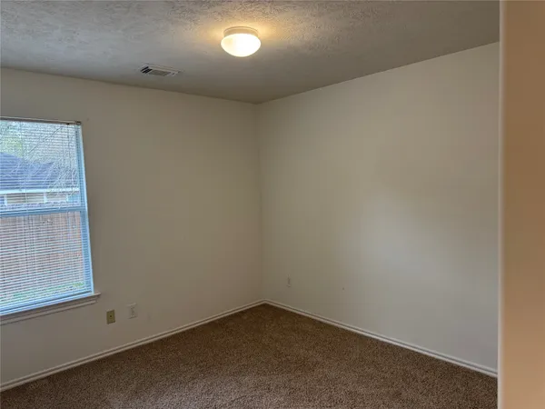 an entrance to house with yard