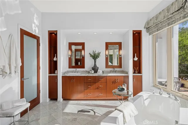 a bedroom with a bed and glass window