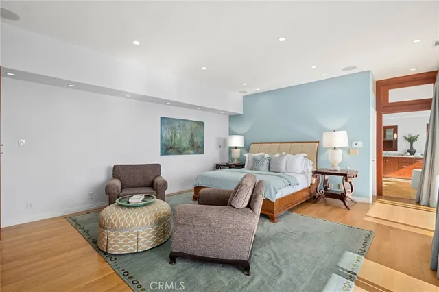 a view of living room with furniture and large windows