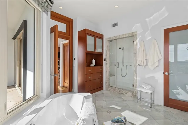 a bedroom with furniture and a table