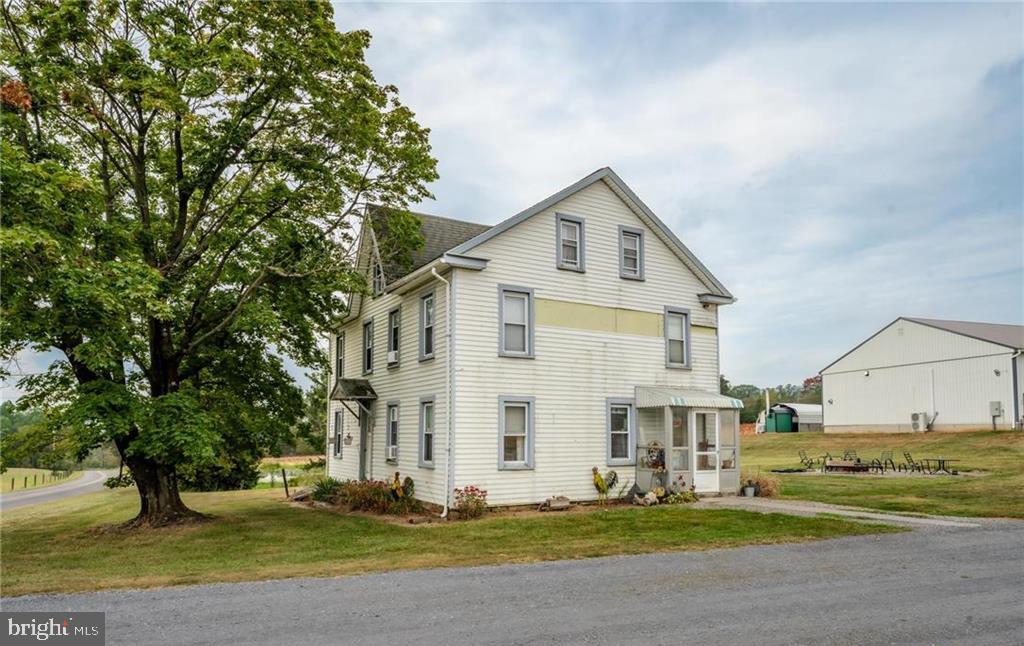 7573 Springhouse Road New Tripoli, PA 18066 - Photo 34 of 54 a view of a white house with a yard and large trees