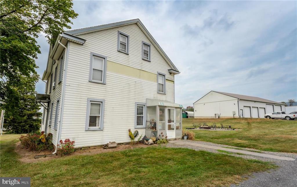 7573 Springhouse Road New Tripoli, PA 18066 - Photo 35 of 54 a front view of a house with a yard