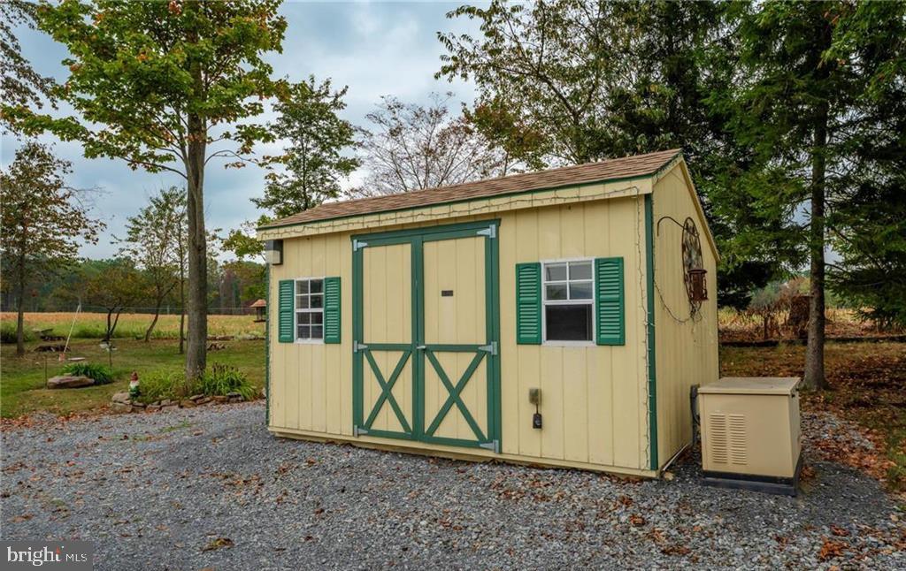 7573 Springhouse Road New Tripoli, PA 18066 - Photo 41 of 54 a view of a small house with a yard