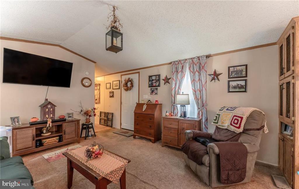 7573 Springhouse Road New Tripoli, PA 18066 - Photo 44 of 54 a living room with furniture and a flat screen tv