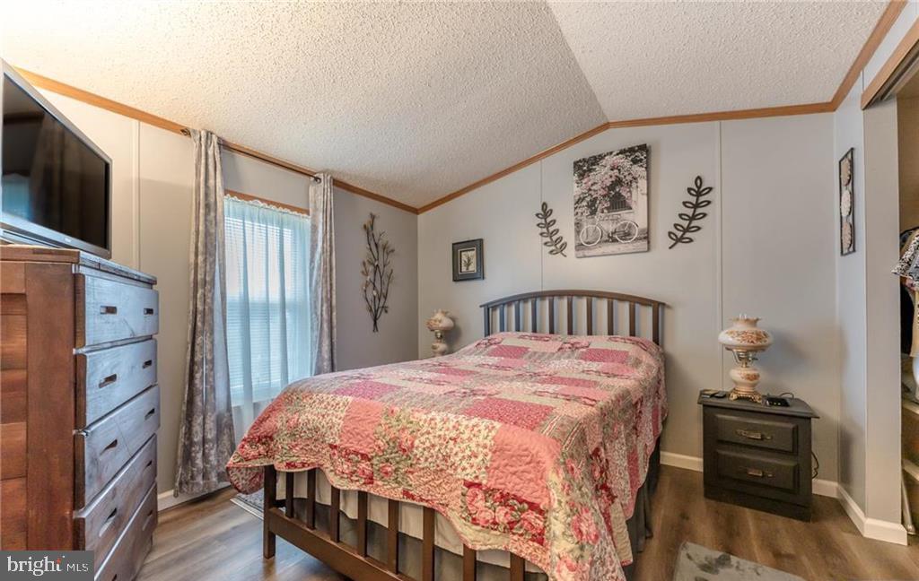 7573 Springhouse Road New Tripoli, PA 18066 - Photo 46 of 54 a bedroom with a bed and a flat screen tv