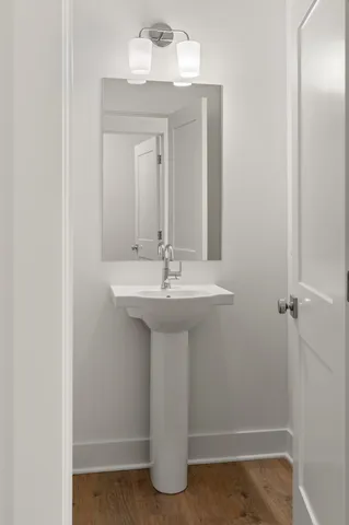 a bathroom with a sink a mirror and vanity