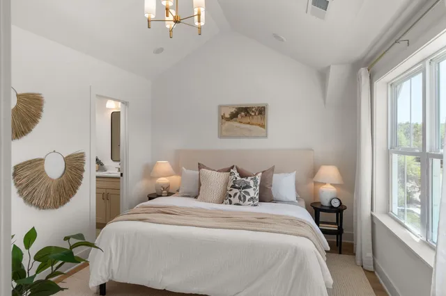 a bedroom with bed and window